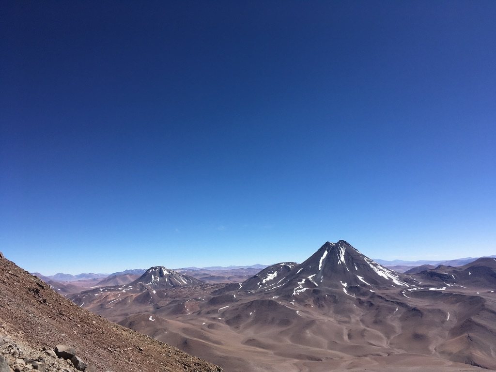 View across Altiplano volcanoes under a deep blue sky